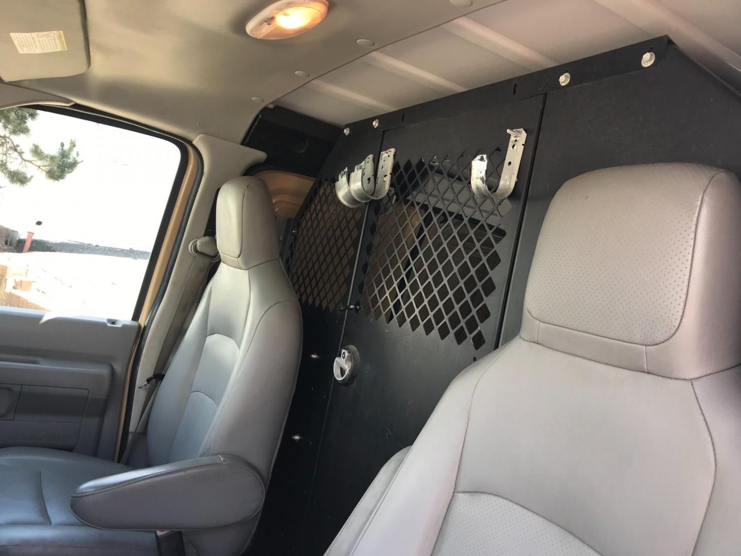2011 Tan /Gray Ford E-Series Van E250 (1FTNE2EW5BD) with an 4.8 V8 engine, Automatic transmission, located at 577 Chester Pike, Prospect Park, PA, 19076, (610) 237-1015, 39.886154, -75.302338 - 2011 Ford E250 Cargo Van: Ladder racks, shelving, heavy duty partition, power inverter, fully metal body, FLEET MAINTAINED, runs LIKE NEW! This vehicle comes inspected and has been given a bumper to bumper safety check. It is very clean, reliable, and well maintained. We offer a unique pay plan t - Photo#10